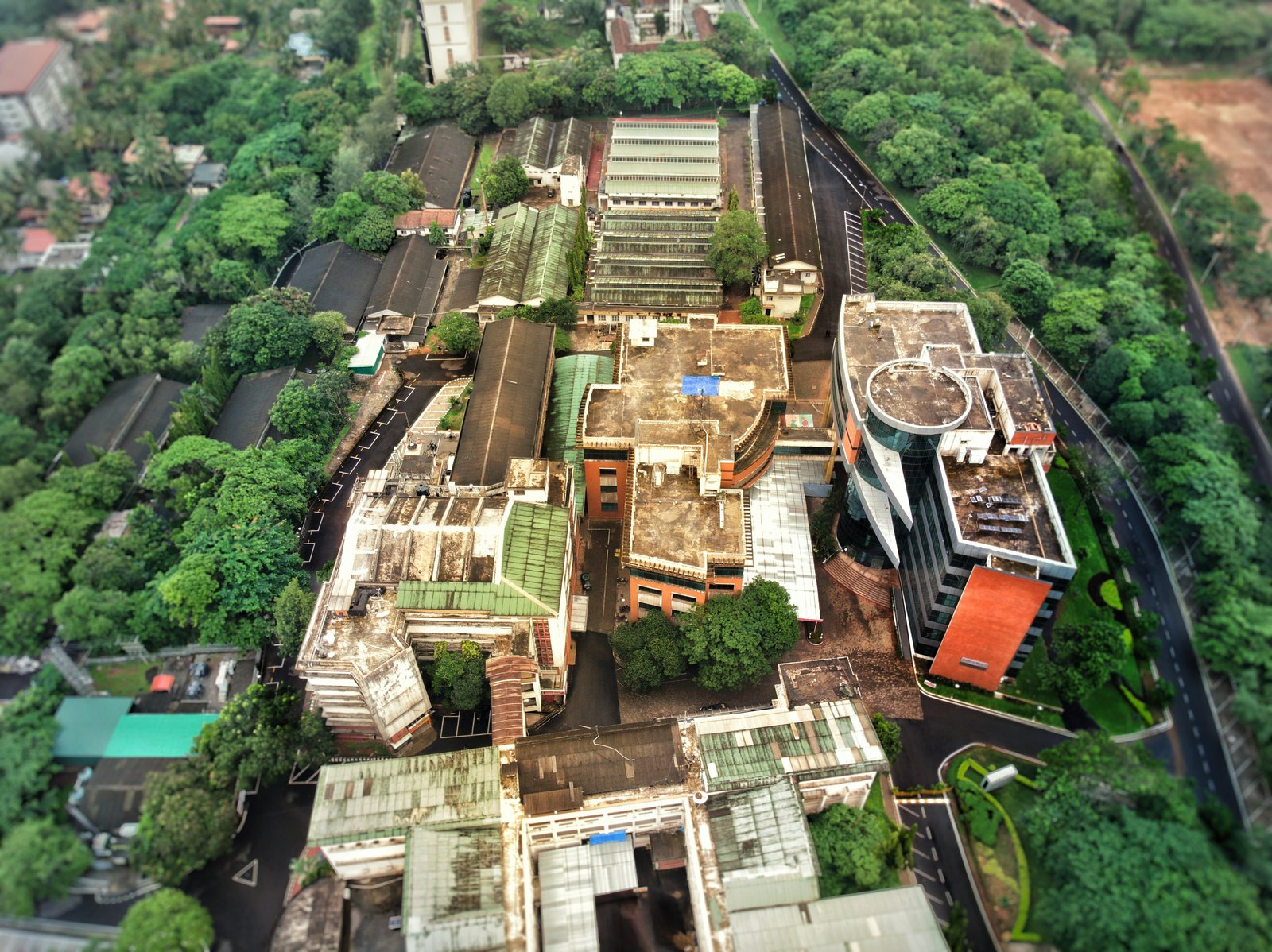 Aerial view of MIT Manipal buildings surrounded by green trees